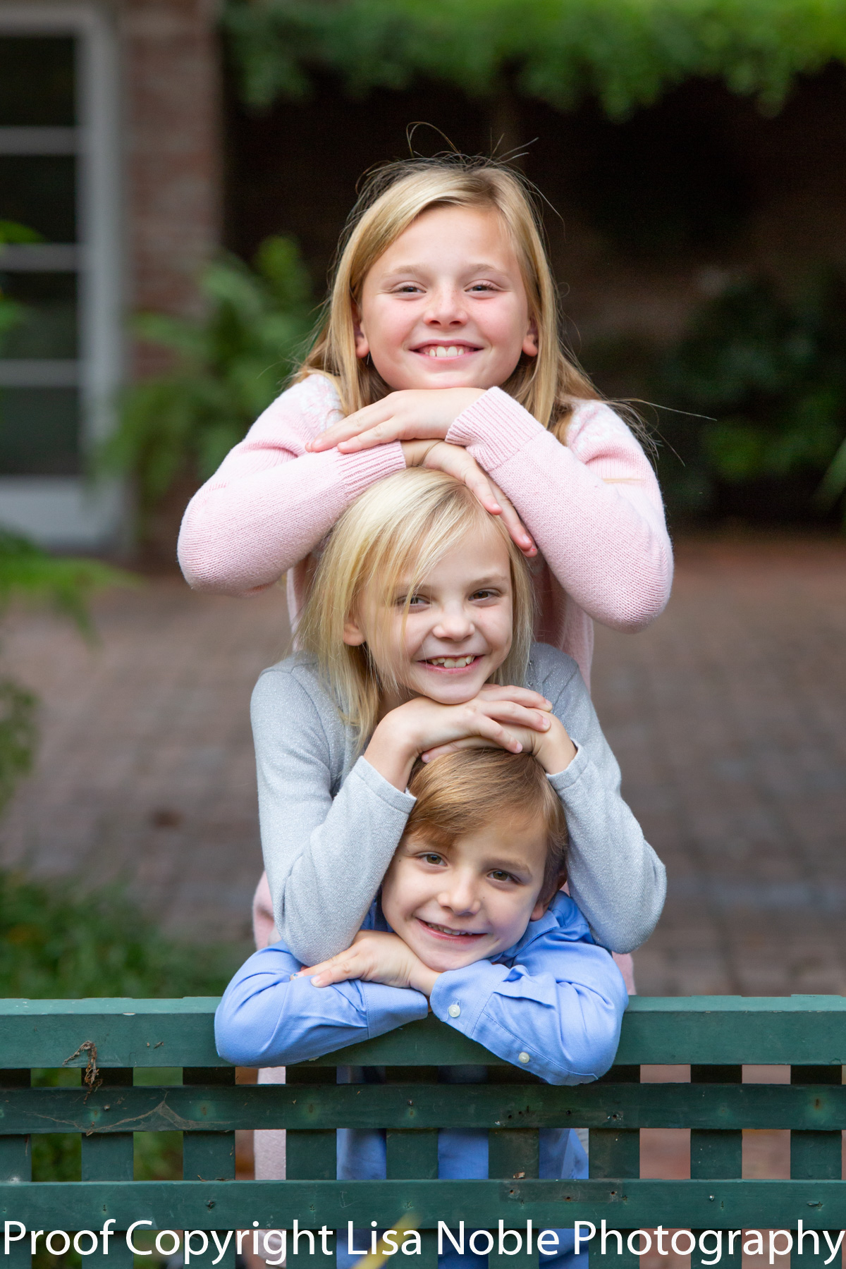 Three siblings on Bench during family photography session